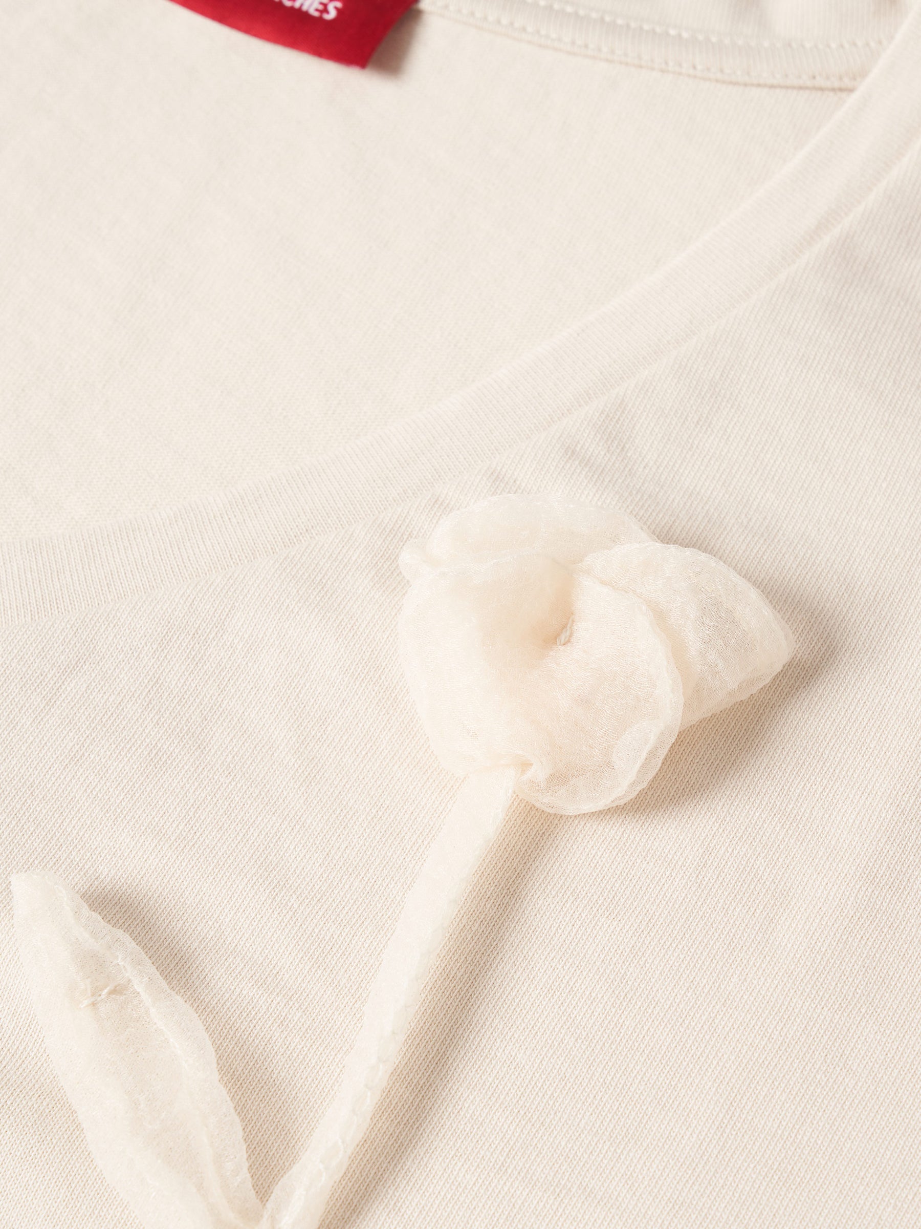 T-shirt de algodão com flor bordada