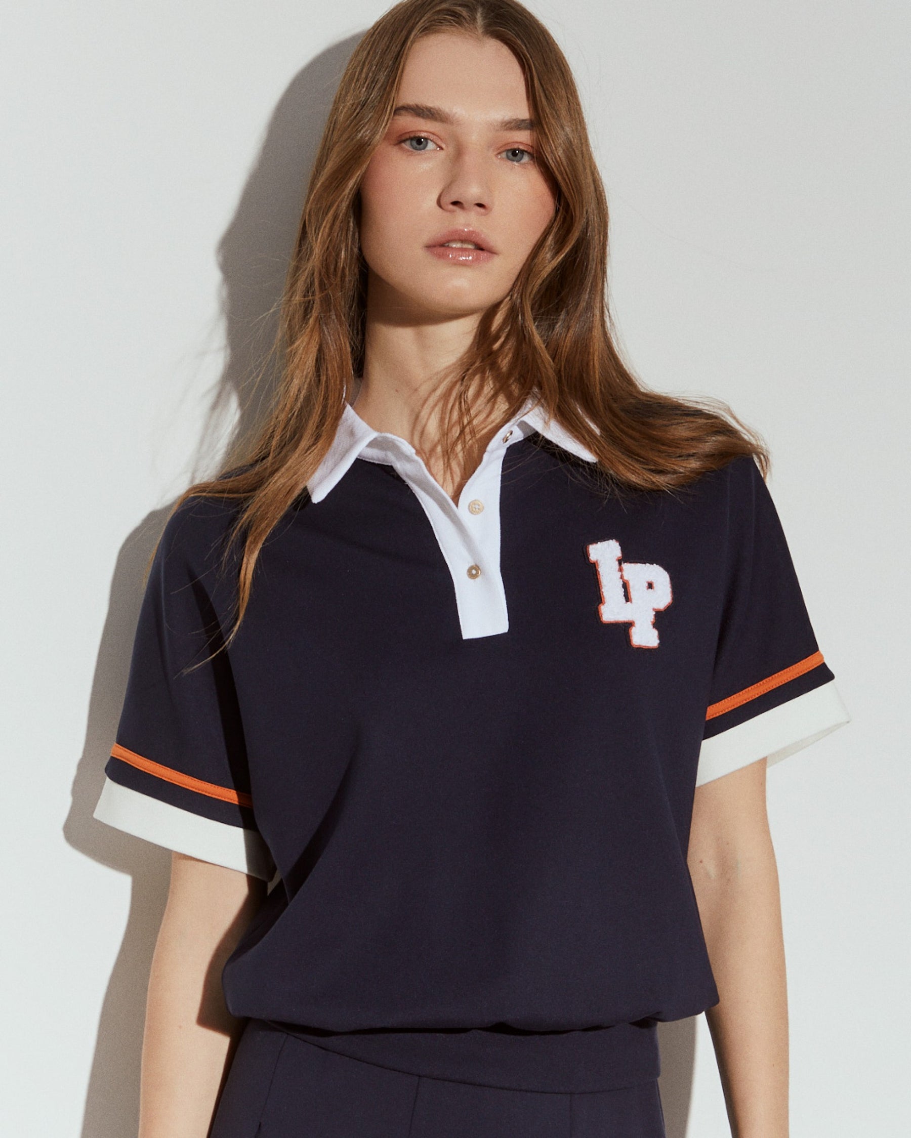 Polo de malha tricolor