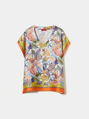 Blusa estilo poncho com padrão tropical