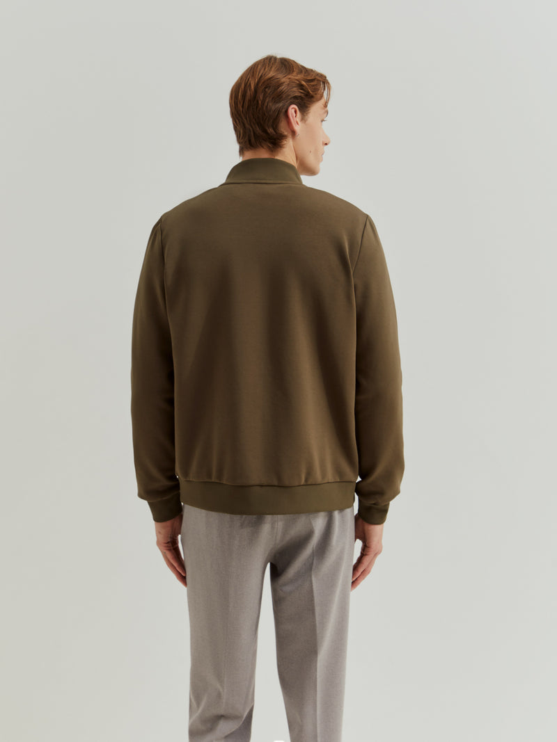 Casaco em tecido técnico com frente acolchoada